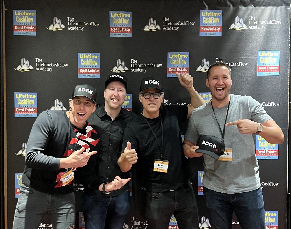The BCGK founders — Brandon, Chuck, Greg, and Kevin — at The Lifetime Cashflow Academy conference